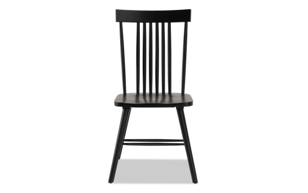 Black Windsor-style dining chair from the Dallas Dining collection, made of durable MDF with a sleek transitional design and vertical spindle backrest.