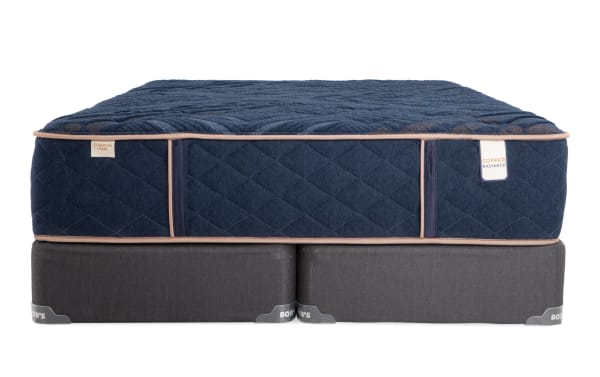 Copper Radiance 13'' King Firm Split Standard Mattress Set in navy blue with quilted copper-infused cover, gel layers, and gray foundation by Bob-O-Pedic.