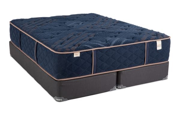Copper Radiance 13'' King Firm Split Standard Mattress Set with dark blue copper-infused quilted cover, cushion-firm hybrid design, and dark gray foundation by Bob's.