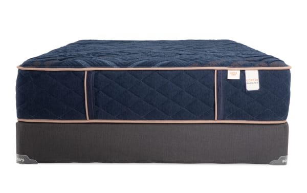 Copper Radiance 13'' Queen Extra Firm Standard Mattress Set with navy blue copper-infused quilted cover, gel layers, wrapped coils, and gray foundation.