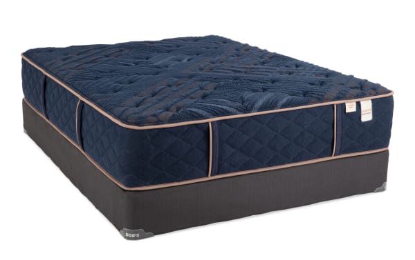 Copper Radiance 13'' Queen Extra Firm Standard Mattress Set with navy blue quilted copper-infused cover, gel layers, wrapped coils, and dark gray foundation by Bob’s.