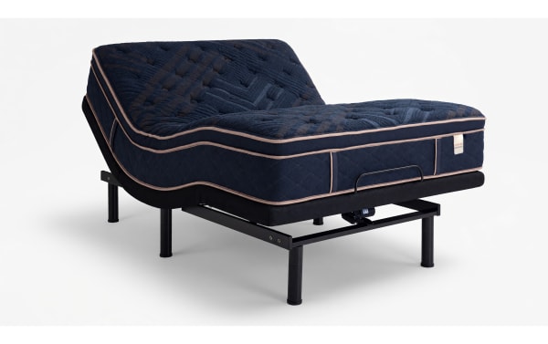 Queen plush Power Bob Ultra Base bed set with Copper Radiance 14.5" mattress, featuring navy quilted copper-infused cover, gel layers, memory foam, and adjustable base in a modern blue bedroom.