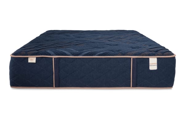 Power Bob Essential Base with Copper Radiance 13'' Queen Firm Mattress in navy blue with quilted copper-infused cover, cushion-firm hybrid design, and beige piping trim.