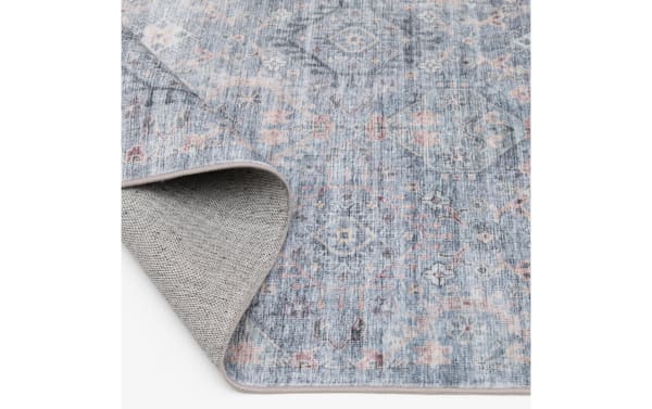 Tidal 5' x 7' blue geometric washable rug with low pile, transitional style, and durable polyester fabric, ideal for kids and pets.