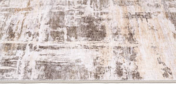 Wells 5' x 7' Brown Abstract Washable Rug with low pile, transitional style, and durable polyester fabric featuring a brown abstract pattern.