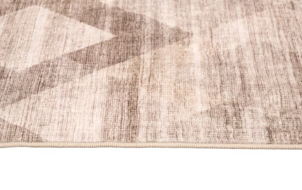 Brown abstract patterned Wells 3' x 6' washable runner with low pile polyester fabric, featuring a transitional style and durable, kid- and pet-friendly design.