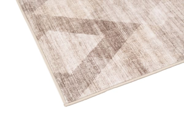 Transitional Wells 2' x 4' brown abstract washable rug with low pile, durable polyester fabric featuring a subtle geometric pattern.