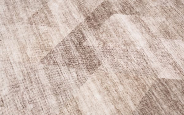 Wells 2' x 4' brown abstract washable rug with low pile, transitional style, and durable polyester fabric featuring a textured geometric pattern.