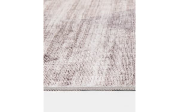 Low pile Salem 5' x 7' brown geometric washable rug in polyester fabric with a subtle transitional pattern, designed for durability and easy cleaning.