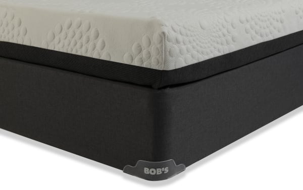 Corner view of Bob-O-Pedic 6.5'' Twin Firm Standard Mattress Set featuring gray fabric border and white textured memory foam top for firm support and comfort.