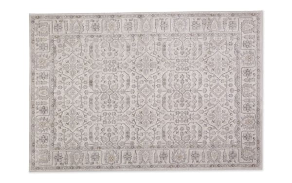 Light gray 5' x 7' Clara Oriental rug with intricate neutral floral and geometric patterns, made of durable polyester fabric for home décor.
