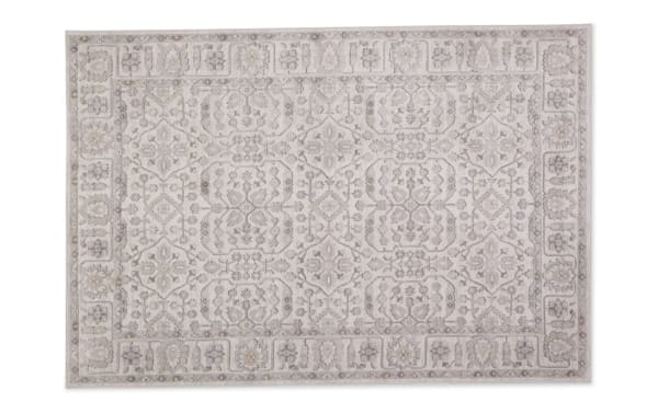 Light gray 8' x 10' Clara Oriental rug with intricate neutral floral and geometric patterns, made from durable polyester fabric.