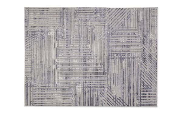 Linea 8' x 10' cream and charcoal abstract shag rug with geometric pattern, soft polyester fabric, adds modern texture and style to home decor.