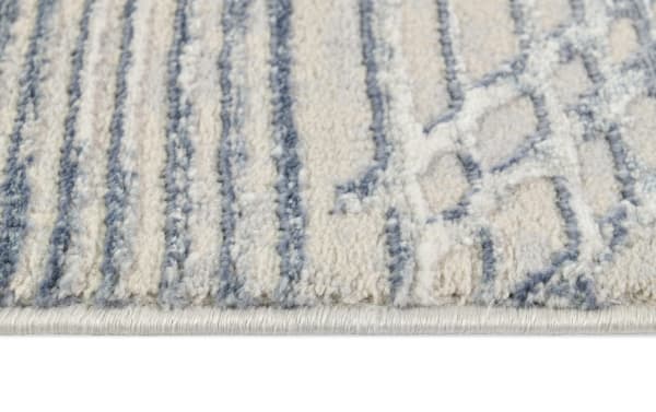 Cream and charcoal abstract shag rug from the Linea collection, 8' x 10', featuring soft polyester fabric with geometric pattern and plush texture.