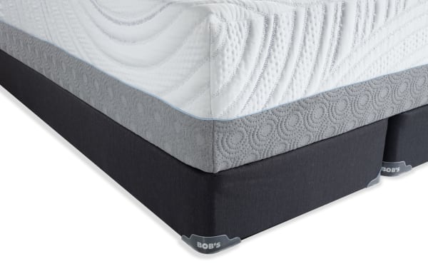 Twilight 15.5'' King Firm Split Standard Mattress Set by Bob's, featuring white quilted top with wave patterns, gray textured side panel, and black fabric foundation.
