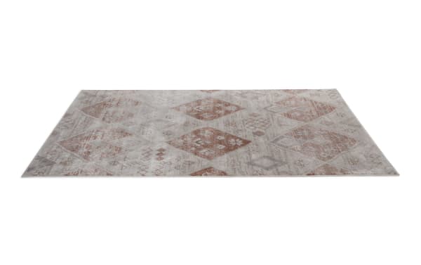 Remy 5' x 7' orange abstract rug with transitional style, soft polyester fabric, warm earth tones, and geometric diamond patterns for versatile home decor.