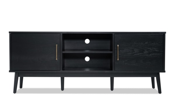 Bettie 60'' black MDF TV console with mid-century modern flared legs, two cabinets, open shelves, and cord management cutouts.