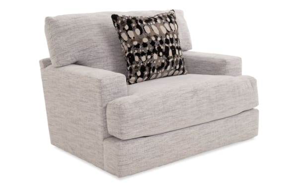 Glacier White Chair in transitional style with plush white polyester fabric upholstery, memory foam cushions, and patterned accent pillow from Glacier collection.