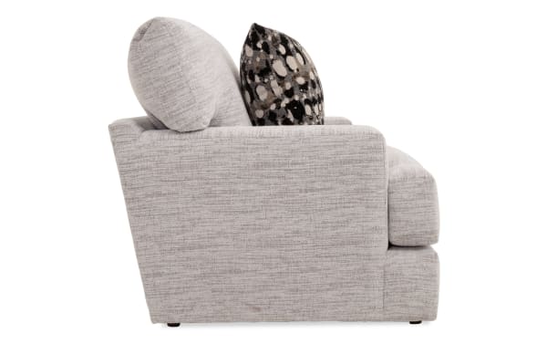 Transitional Glacier White Chair with plush white polyester fabric upholstery, Bob-O-Pedic memory foam cushions, and patterned accent pillow.