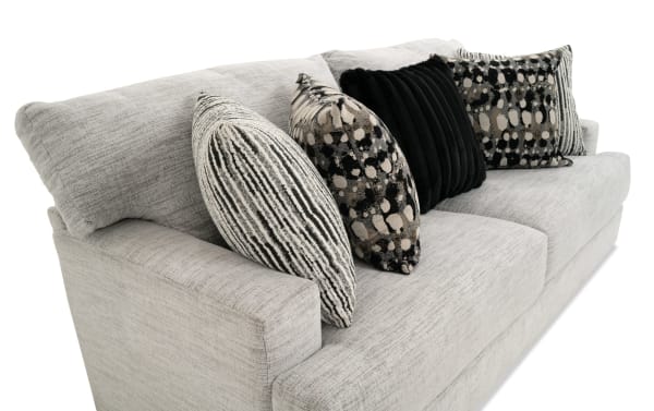 Transitional Glacier White 93'' Sofa with plush white polyester fabric upholstery, Bob-O-Pedic memory foam cushions, and five decorative accent pillows.