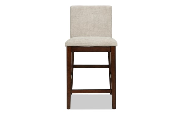 Contemporary Mango Dining counter height stool with beige polyester fabric upholstery, solid mango wood frame, and memory foam seat for comfort.