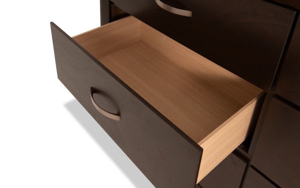 Open drawer of Tremont Espresso 6 Drawer Dresser showing smooth rubberwood solid interior with dark espresso veneer front and curved metal handle in transitional style.
