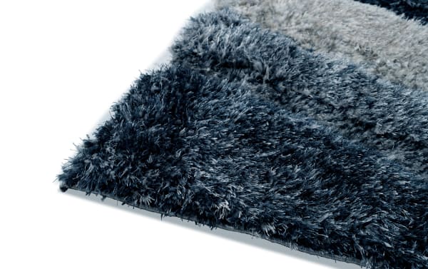 Contemporary Swirls 8' x 10' blue and gray abstract rug with plush medium pile polyester fabric, ideal for modern home decor.