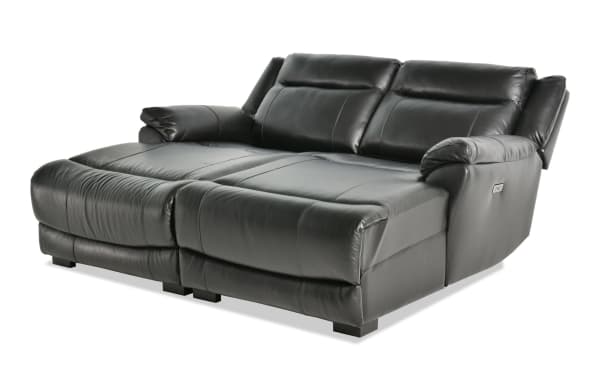 Frontier Black Leather 77'' Power Reclining Dual Chaise with USB & USB-C Ports, transitional style, plush real leather upholstery, power recline seating, and cushioned armrests.