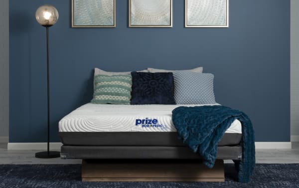 Prize Gel 10'' King Firm Split Low Profile Mattress Set from Bob-O-Pedic Prize collection, featuring white gel memory foam top, dark gray base, and blue textured throw blanket on a modern bed frame.