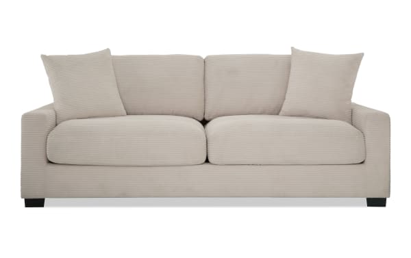 Transitional Aspen Beige 86'' sofa with plush polyester fabric upholstery, cushioned memory foam seats, and matching accent pillows for cozy living rooms.