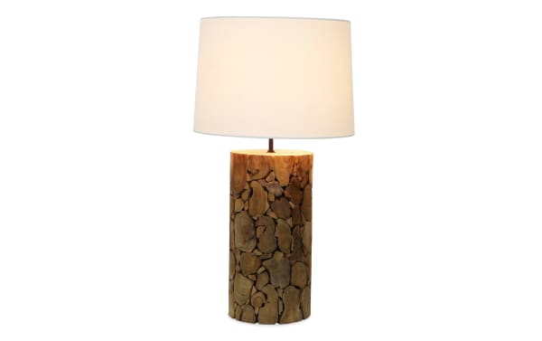 Amber Natural Wood Table Lamp with a unique cylindrical wooden base made of natural wood pieces and a white fabric drum shade in a transitional style.