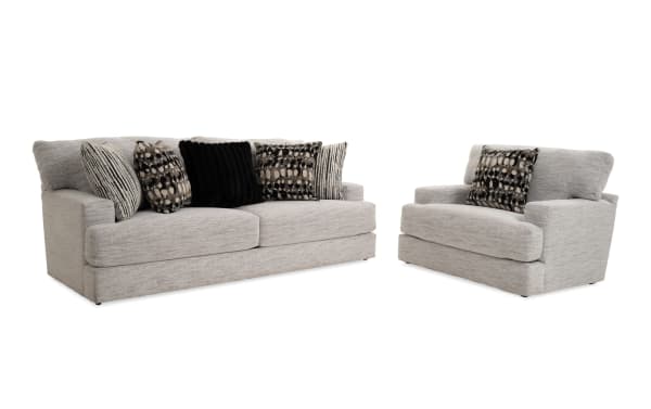 Transitional Glacier White 93'' sofa and chair set with plush white polyester fabric, Bob-O-Pedic memory foam cushions, and six patterned accent pillows.