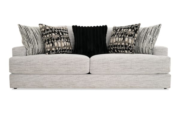Glacier White 93'' transitional sofa with plush white polyester fabric, Bob-O-Pedic memory foam cushions, and six patterned accent pillows.