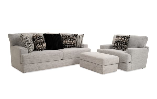 Glacier White 93'' transitional sofa, chair, and ottoman set with plush white polyester fabric, Bob-O-Pedic memory foam cushions, and six patterned accent pillows.
