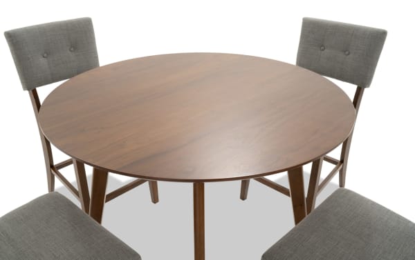 Mid-century modern Bettie 5-piece dining set with round walnut veneer table, gray polyester upholstered chairs, button tufting, and flared legs.