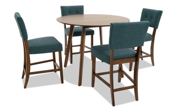 Mid-century modern Bettie 5 Piece Walnut & Teal Upholstered Round Counter Height Dining Set with button tufted teal polyester fabric seats, flared walnut veneer legs, and Bob-O-Pedic Memory Foam cushions.