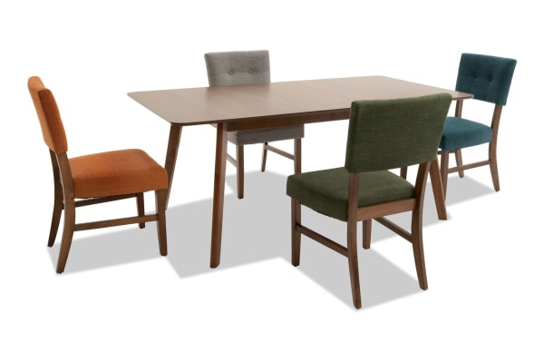 Bettie 5 Piece Walnut & Multicolor Upholstered Extendable Dining Set with mid-century modern rubberwood table, fabric button-tufted chairs in gray, green, russet, and teal, featuring flared legs and removable 12" leaf for extra space.
