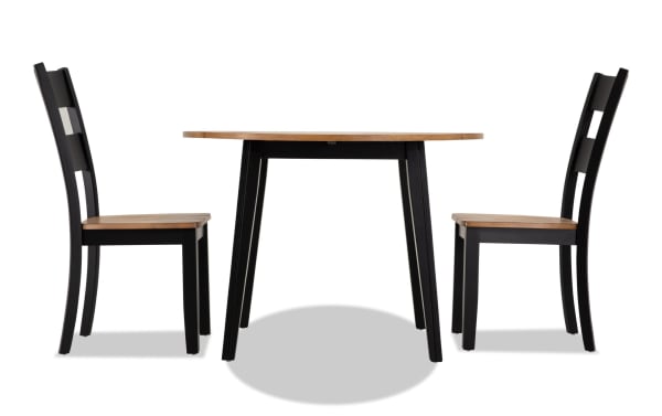 Blake 3 Piece Black & Natural Round Extendable Dining Set with two black cottage-style chairs and a round drop leaf table in MDF and hardwood solids.