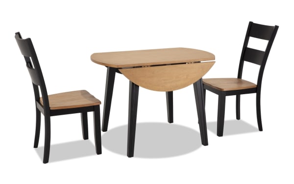 Blake 3 Piece Black & Natural Round Extendable Dining Set with two black and natural wood cottage-style chairs and a round drop leaf table in MDF and hardwood solids, ideal for small spaces and modern farmhouse decor.