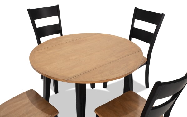 Blake 5 Piece Black & Natural Round Extendable Dining Set with drop leaf table and four black ladder-back chairs, cottage style in MDF and hardwood.
