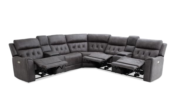 Gray sectional reclining sofa with plush tufted cushions, stitched faux leather upholstery, and multiple recliner seats for living room comfort.
