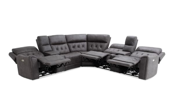 Gray microfiber sectional sofa with four electric recliners, tufted back cushions, and adjustable headrests, designed for modern living rooms.