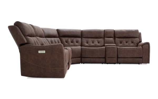 Brown leather sectional recliner sofa with tufted backrests, power reclining controls, and cupholder console, designed for living room comfort.