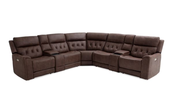Brown leather sectional recliner sofa with tufted back cushions, cup holders, and padded armrests, designed for living room comfort and style.