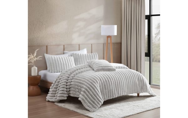Sofia Twin/Twin XL gray faux fur 3-piece comforter set with plush, textured polyester fabric in contemporary style, featuring ribbed design and matching pillows.