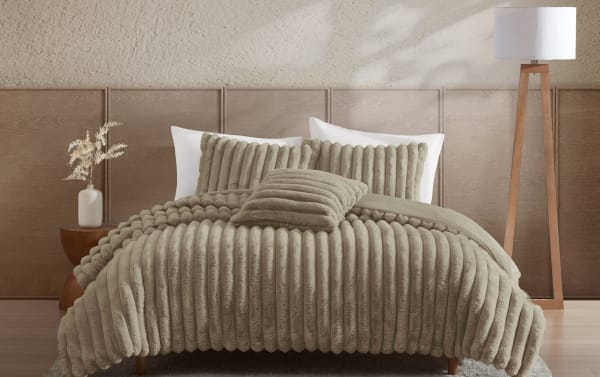 Contemporary Sofia Full/Queen Taupe Solid Faux Fur 4 Piece Comforter Set with plush ribbed texture, soft polyester fabric, and tan color for cozy, stylish bedding.