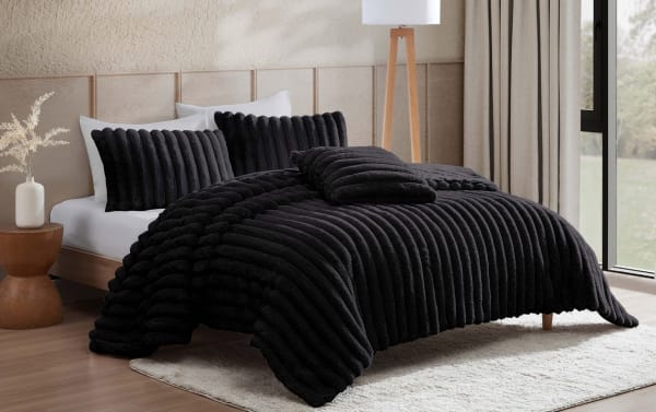 Sofia Full/Queen black solid faux fur 4-piece comforter set in plush textured polyester fabric, contemporary style with ribbed pattern and matching pillows.