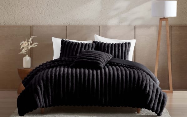 Sofia Full/Queen black faux fur 4-piece comforter set with plush ribbed texture, polyester fabric, contemporary style for cozy, stylish bedding.