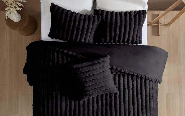 Sofia Full/Queen black solid faux fur 4-piece comforter set with textured, plush polyester fabric in contemporary style for cozy bedding.