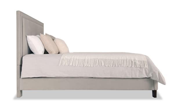 Tremont transitional full bed in gray polyester fabric upholstery with MDF and rubberwood frame, featuring a tall padded headboard and low-profile footboard.